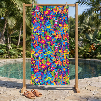 Groovy Garden beach towel, displayed in a summer setting.