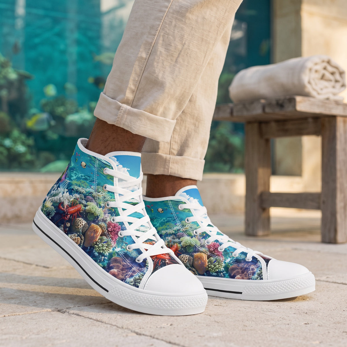 Coral Gaze Men's High Top Sneakers. Lifestyle scene: Coastal aquarium terrace