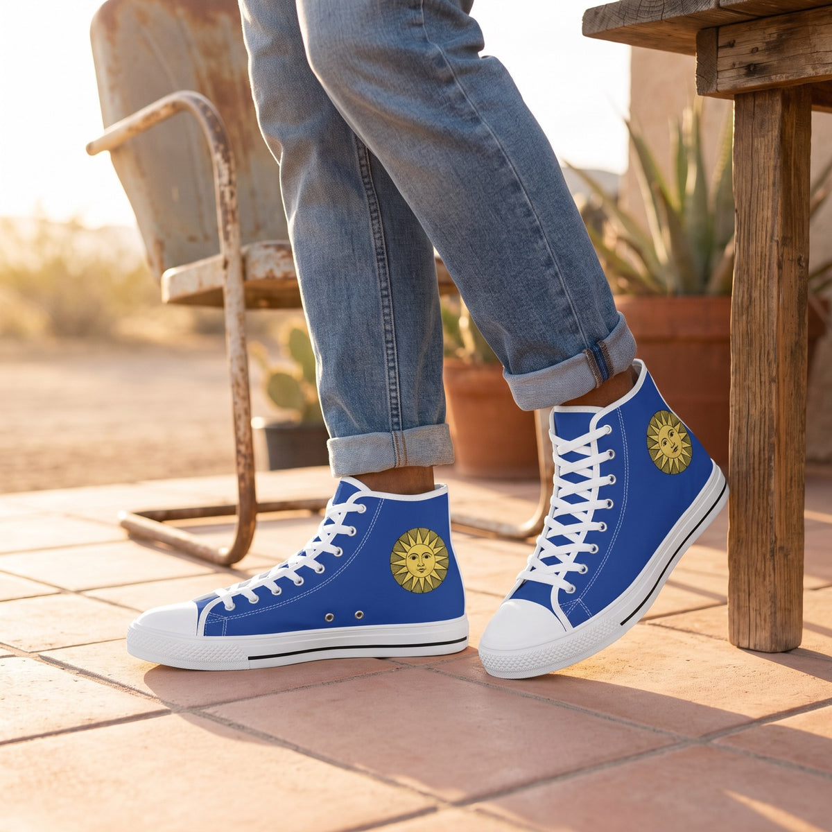 Vintage Sun Men's High Top Sneakers — Desert roadside café patio; peach tiles, vintage metal chair, warm late-afternoon sun