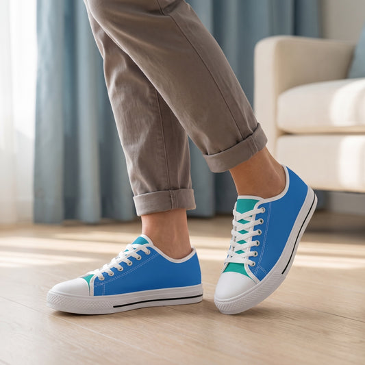 Paradise Blue Ladies' Two-Tone Low Top Sneakers — Coastal hotel lobby; pale oak floor, ivory lounge chair, soft blue drapes lit by daylight