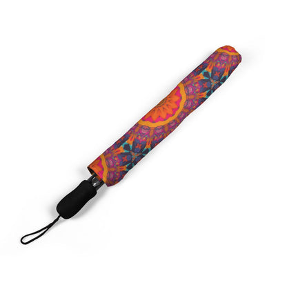 Fiery Mosaic Magic umbrella folded closed, showing the printed canopy and wrist strap