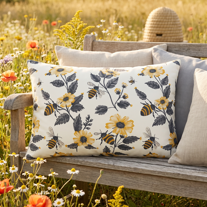 Buzzing Blossoms lumbar outdoor pillow styled in a sunlit outdoor setting