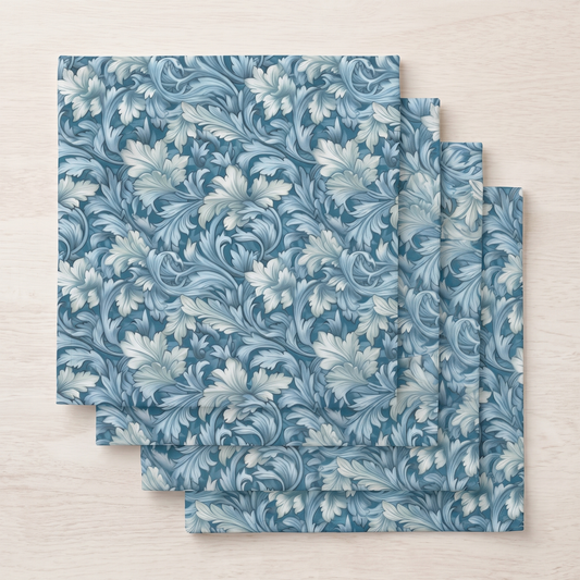 Four folded Soft Blue Leaf Tapestry dinner napkins fanned in a stack, top-down view