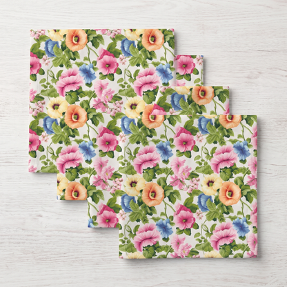 Four folded Pastel Garden Elegance dinner napkins fanned in a stack, top-down view