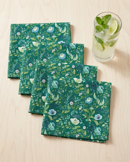 Serene Green Floral cocktail napkins, set of four, with drink for scale