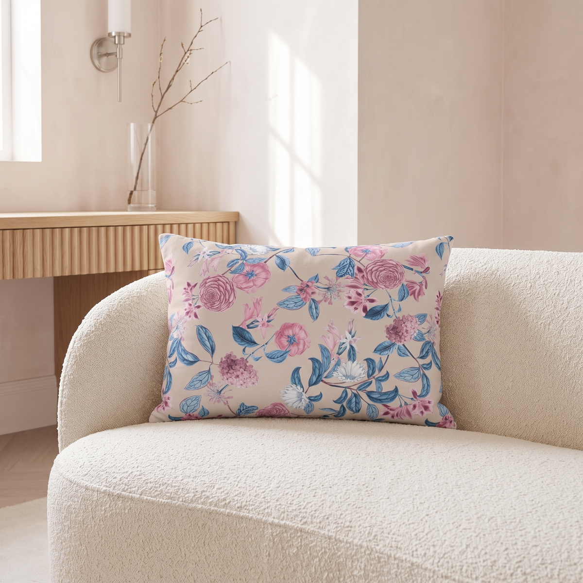 Blush Bloom Serenity lumbar pillow on an ivory boucle chair