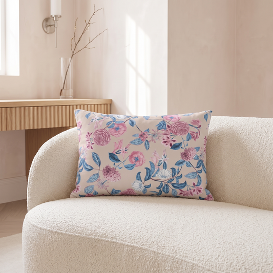 Blush Bloom Serenity lumbar pillow on an ivory boucle chair