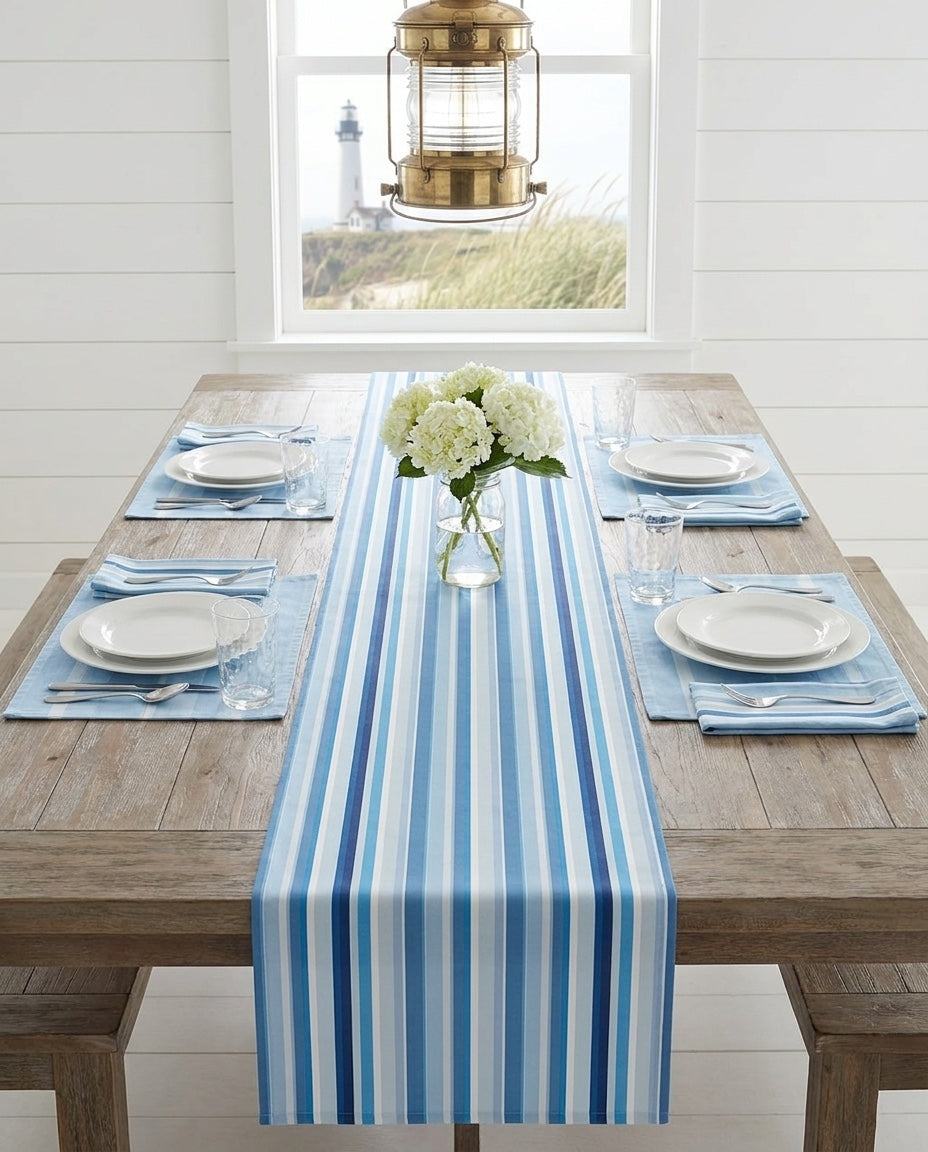 Shades of Light Blue Stripes napkins styled with the matching placemats and table runner